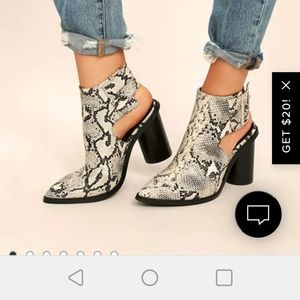 Snake pointed ankle boots.